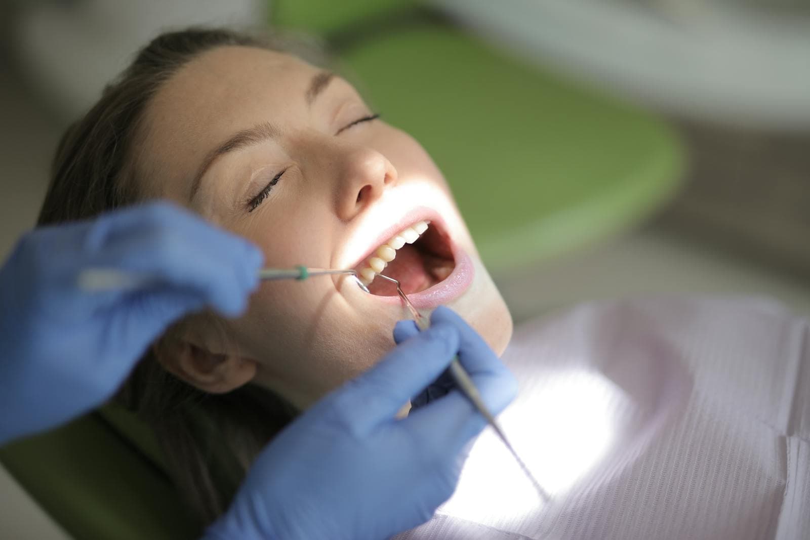 Dentist performing a professional teeth cleaning